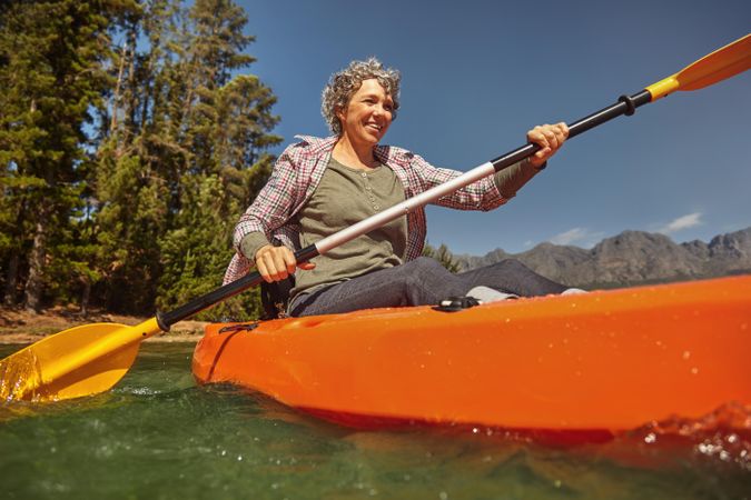 Portrait of woman paddling in a lake