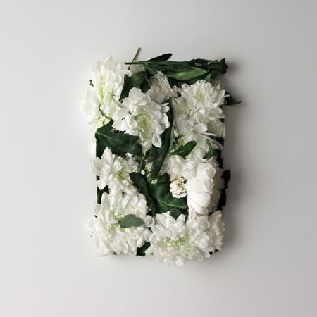 Flowers in shape of a gift box on light  background