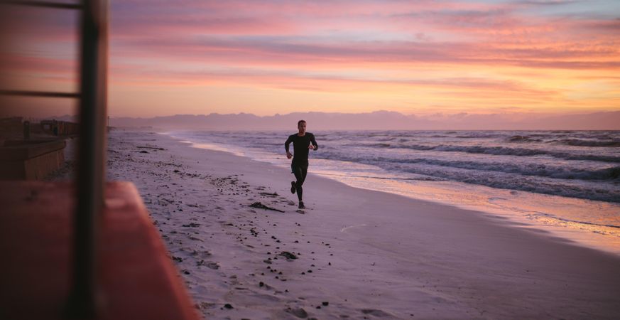 Man training on the beach in morning