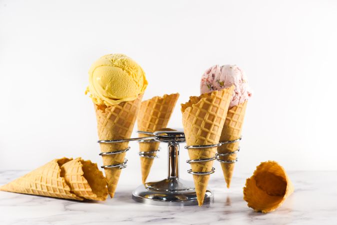 Ice cream cone stand with waffle cones and two different scoops