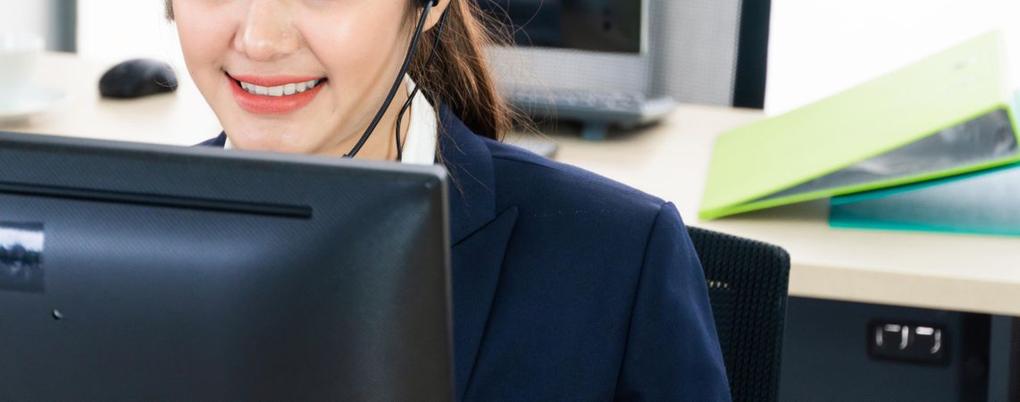 Close up banner of woman working in business call center