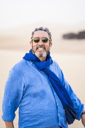 Older man walking in desert