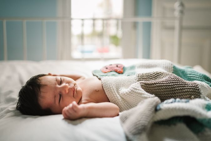 Cute baby sleeping on bed