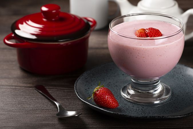 Delicious strawberry mousse in glass goblet.