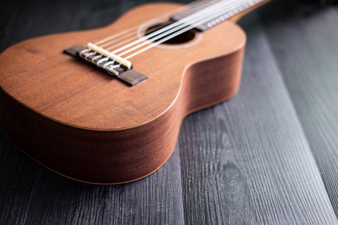 Ukulele on wooden tabletop
