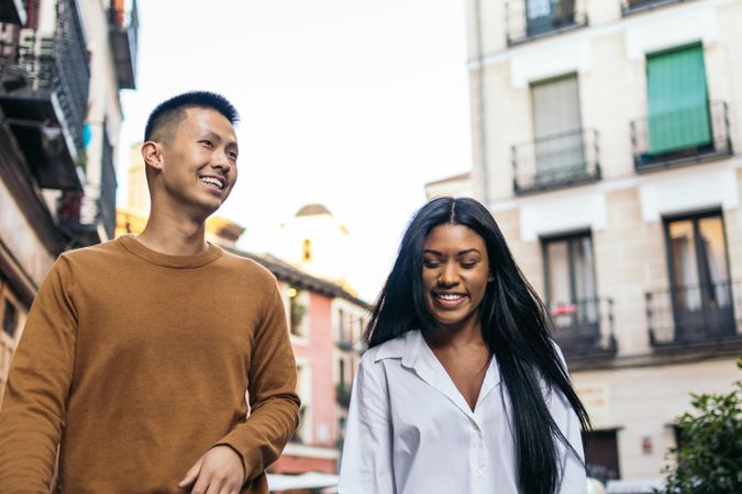 Interracial friends walking down the street
