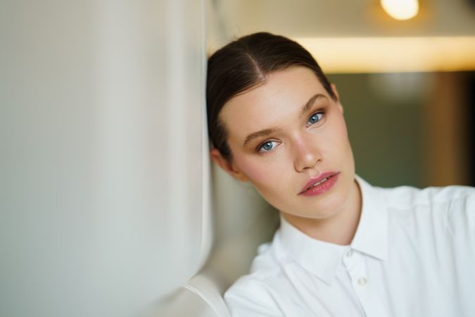 Woman leaning on wall