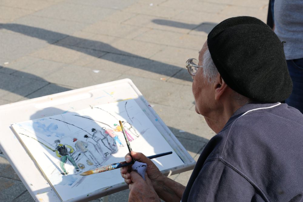 Woman drawing people fishing
