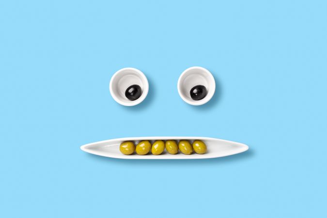 Olives on tray forming a face