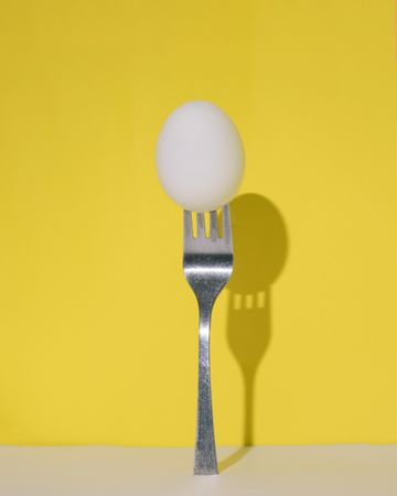 Hard boiled egg on fork