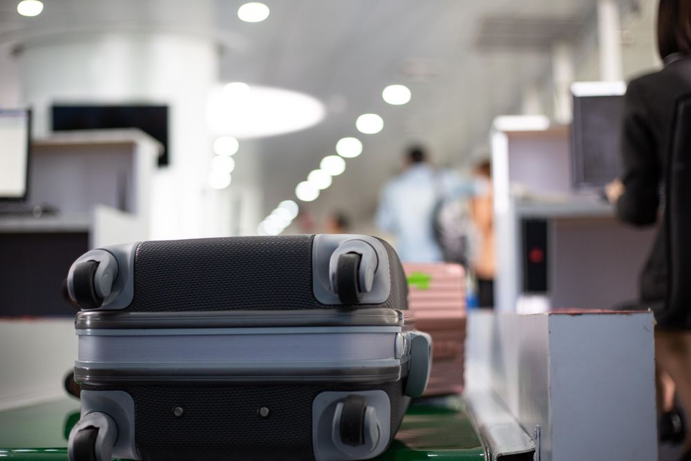 Suitcase at check in counter at airport