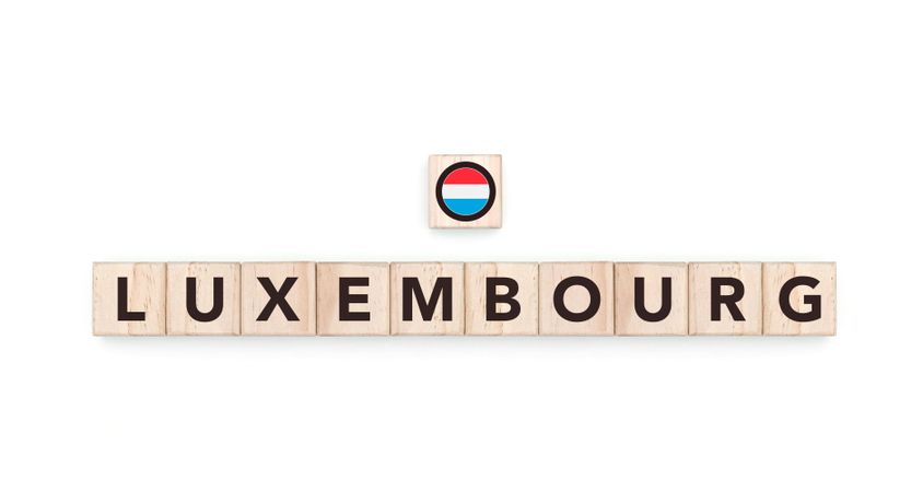 Wooden blocks bearing the name and flag of Luxembourg. Luxembourgger and European Culture, national identity, travel, and geography in a copy space design.