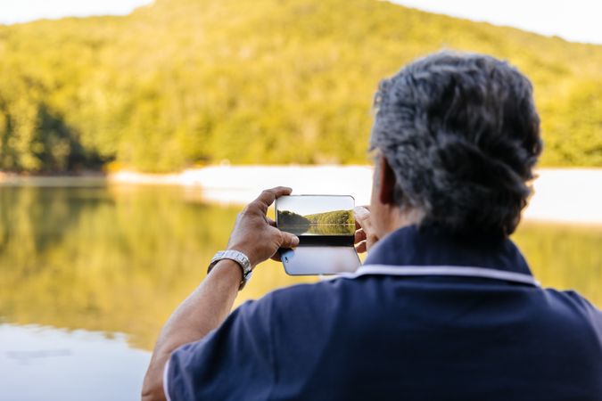 Man taking picture of landscape