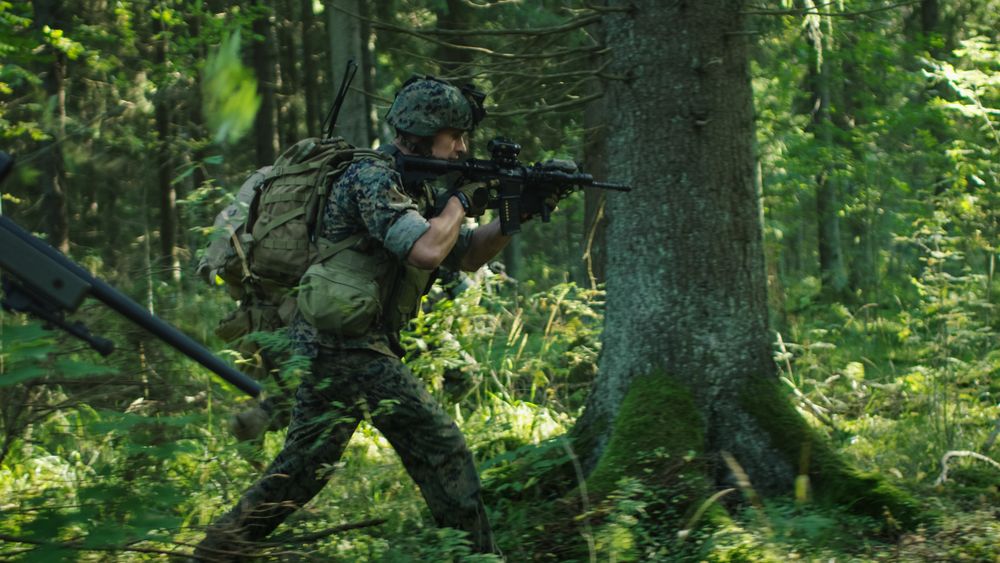 Squad of Fully Equipped Soldiers in Camouflage on a Reconnaissance Military Mission
