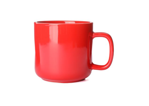 Empty ceramic cup isolated on studio background