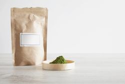 Matcha tea powder in brown bag