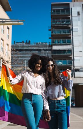 Lesbian couple with LGBT flag