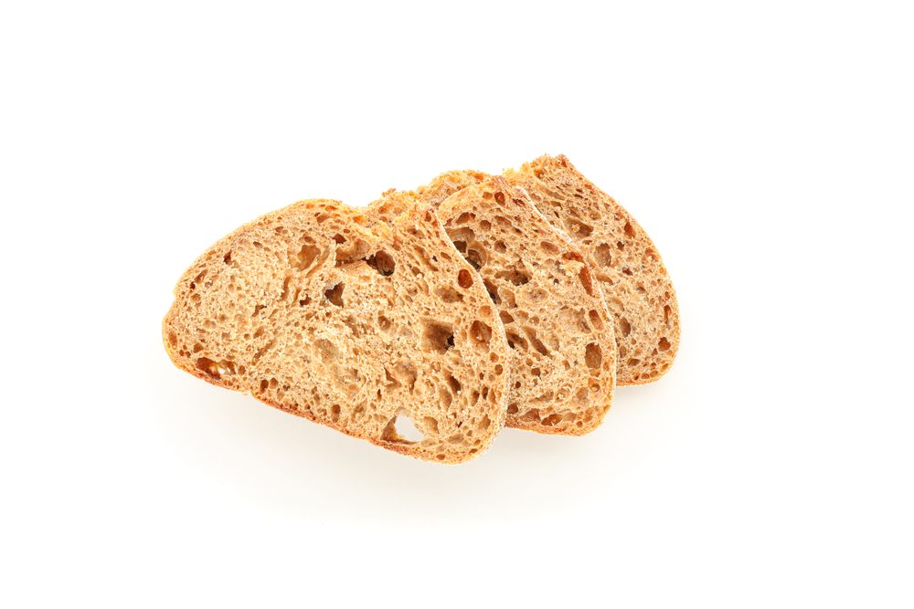 Wheat bread pieces isolated on blank background. Bakery products