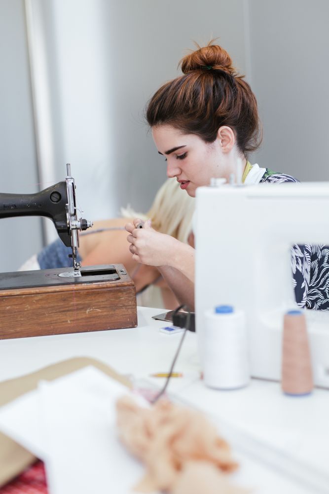 Woman in a sewing school