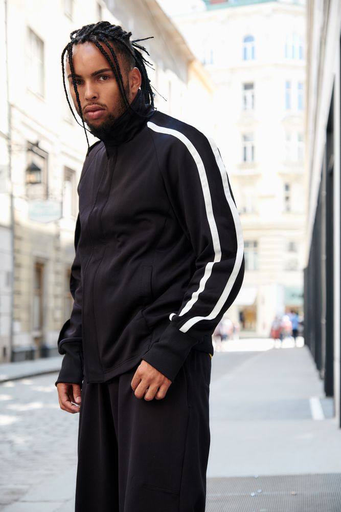 Black male standing on the street