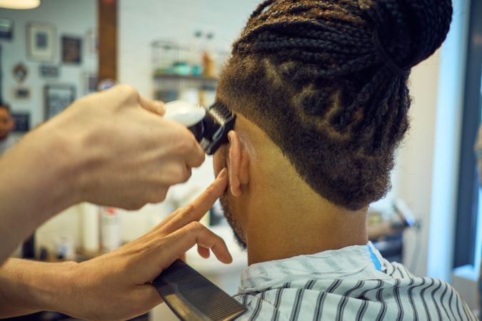 Anonymous hairstylist doing a haircut