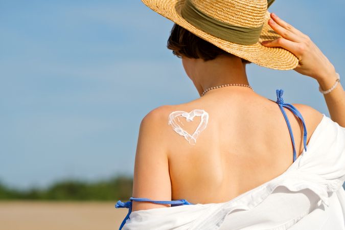 Woman with Sunscreen in heart shape