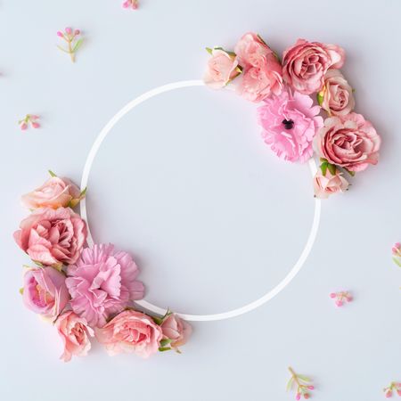 Creative layout made of colorful spring flowers and illuminated circle