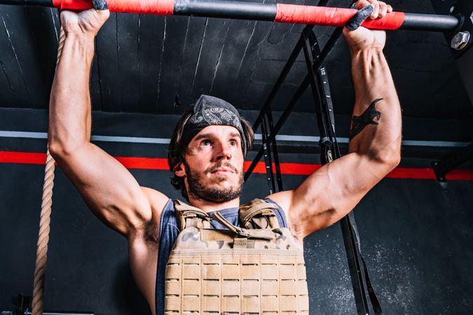Hardworking male training in gym