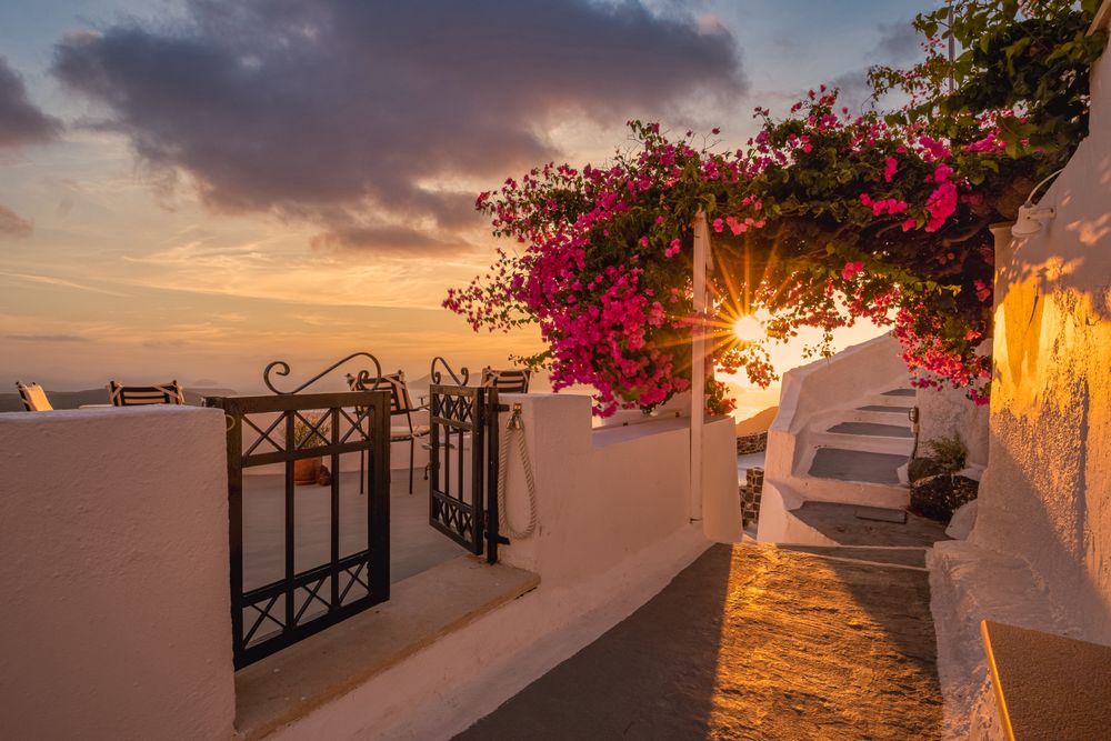 Entrance to rooftop looking out over Aegean Sea with sunflare