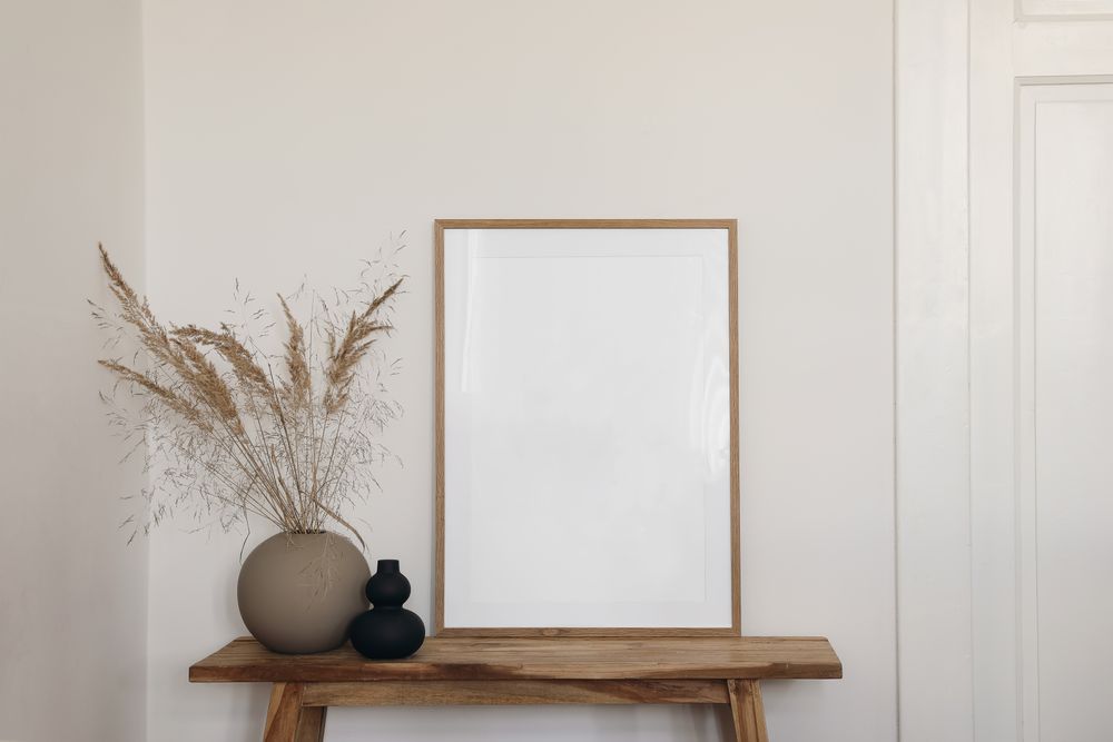 Entry table with mockup poster and vase and decorative reeds