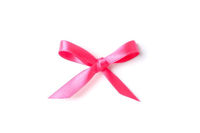 Pink bow isolated on plain background. Gift concept