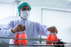 Man working with juice bottled in factory 0K23Ab