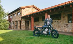 Man posing with a custom motorbike