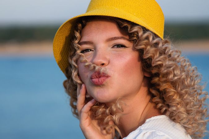 Portrait curly haired woman outdoors