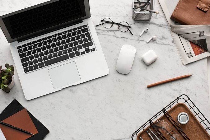 Modern Workspace Desk with Laptop, Office Supplies, and Accessories in a Minimal Style
