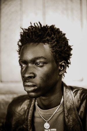 Grayscale portrait of African looking away