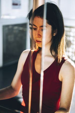 Concentrated ballerina reflecting in mirror