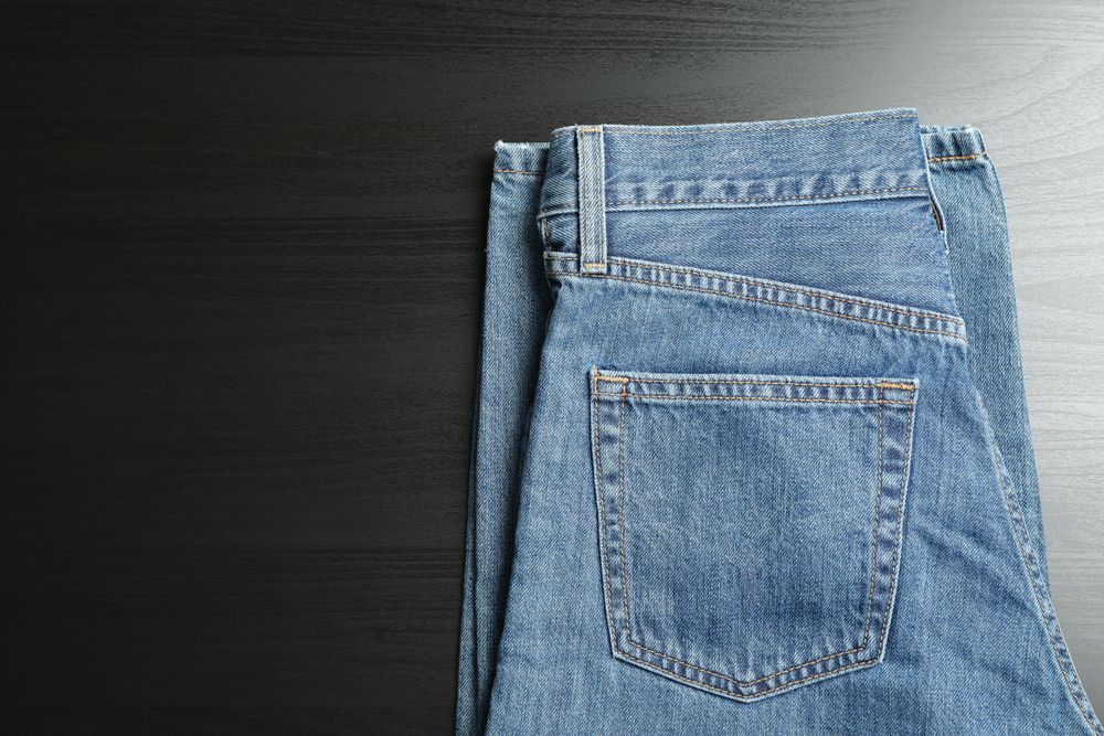 Classic jeans on background, space for text