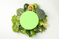 Fresh green vegetables and space for text on blank background
