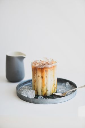 Iced coffee cocktail with milk, and tray