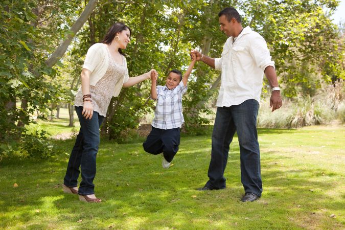 Young Hispanic Family Having Fun in the Park