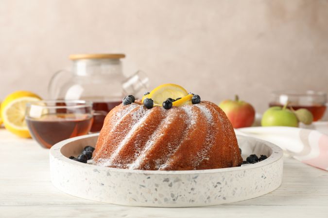 Cake with powder sugar and lemon, space for text