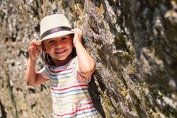 Girl in narrow stone walkway