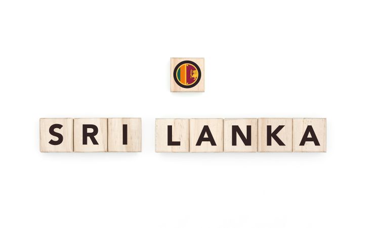 Wooden blocks bearing the name and flag of Sri Lanka. Sri Lankan and Asian Culture, national identity, travel, and geography in a copy space design.