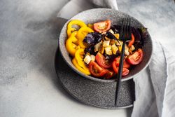 Healthy gourmet salad with tomatoes and yellow peppers
