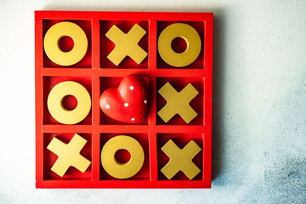 St. Valentine day card concept with heart in center of tic-tac-toe game