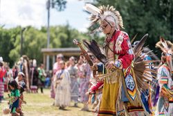 Red Wing, MN, USA - July 8th, 2017: Mature Sioux man in traditional feathered regalia