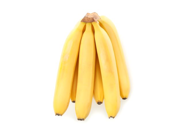 Banana cluster isolated on light background. Fresh fruit