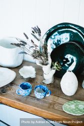 Shelf of ceramic dining ware in artisanal shop bxZZZ5