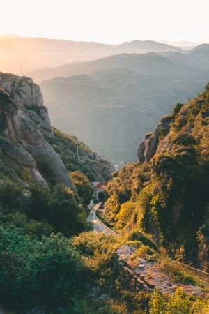 Deserted railway road between rocks leading to tunnel